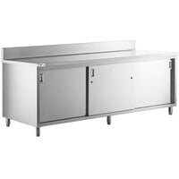 Regency 30" x 96" 16 Gauge Type 304 Stainless Steel Enclosed Base Sliding Door Table with Adjustable Midshelf and 6" Backsplash