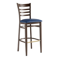 Lancaster Table & Seating Spartan Metal Ladder Back Bar Stool with Dark Walnut Wood Grain Finish and Navy Vinyl Seat - Assembled