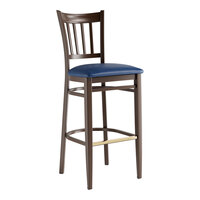 Lancaster Table & Seating Spartan Series Metal Slat Back Bar Stool with Dark Walnut Wood Grain Finish and Navy Vinyl Seat - Assembled