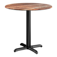 Lancaster Table & Seating Excalibur 32" Round Standard Height Table with Textured Yukon Oak Finish and Cross Base Plate