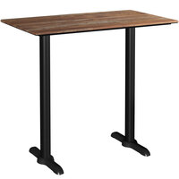 Lancaster Table & Seating Excalibur 28" x 48" Rectangular Bar Height Table with Textured Yukon Oak Finish and Two End Outdoor Base Plates