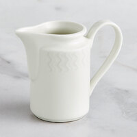 RAK Porcelain Leon 5 oz. Ivory Embossed Porcelain Creamer - 6/Case