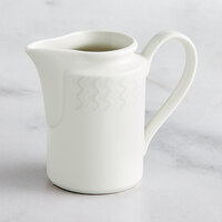 RAK Porcelain Leon 8.5 oz. Ivory Embossed Porcelain Creamer - 6/Case