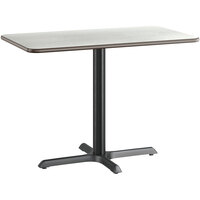 Lancaster Table & Seating 24" x 42" Reversible White Birch / Ash Laminated Standard Height Table and Base Kit with 22" x 30" Cast Iron Base