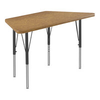 Correll Deluxe Trapezoid Medium Oak 19"-29" Adjustable Height High-Pressure Laminate Top Activity Table with Black Legs and Medium Oak T-Mold