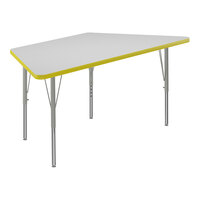 Correll 26" x 58" Trapezoid White 19"-29" Adjustable Height High-Pressure Dry Erase Board Top Activity Table with Silver Legs and Yellow T-Mold
