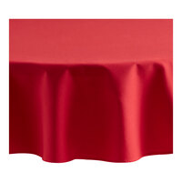 Oxford 72" Round Red 100% Spun Polyester Hemmed Edge Cloth Table Cover - 12/Case