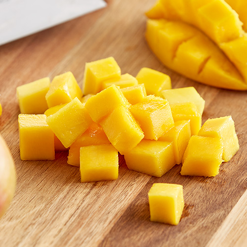 Diced mangos on a cutting board