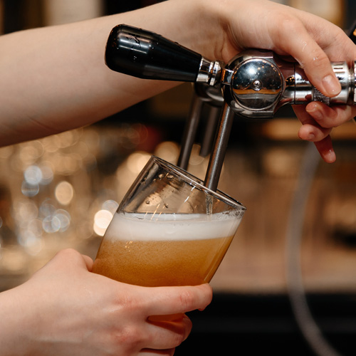 bartender pouring a beer