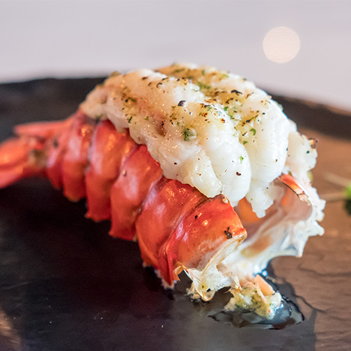 Cooked lobster tail on a plate