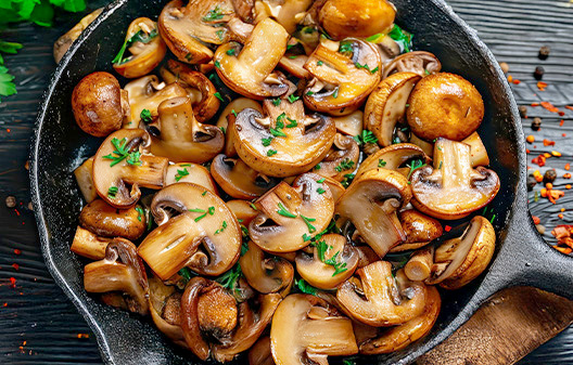 Phillips Gourmet Mushrooms IQF Seasoned Sauteed Roasted Sliced White Mushrooms 2 lb. - 10/Case